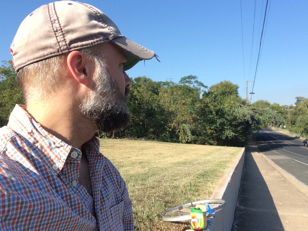Eric looking west down 12th with tools in background